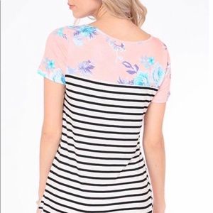 Multi print shirt with cross cross v-neck.